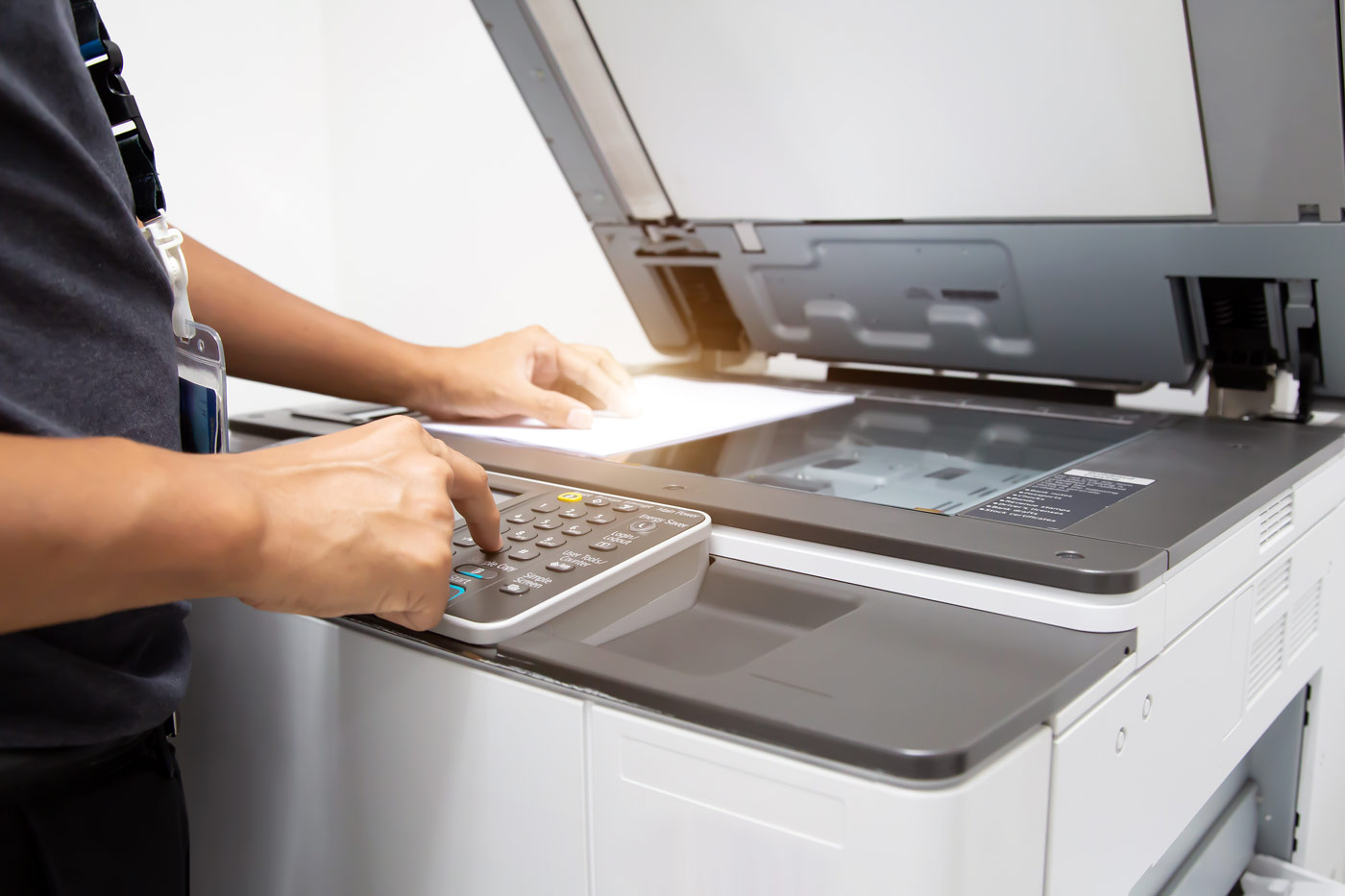 close up hand office man press button copier